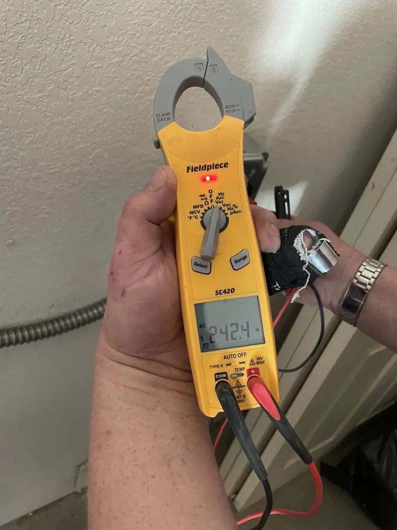 Voltage testing with clamp meter during Ceiling Fan Installation in Woodbury